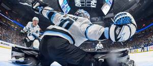 Český brankář Karel Vejmelka předvádí zákrok při utkání NHL